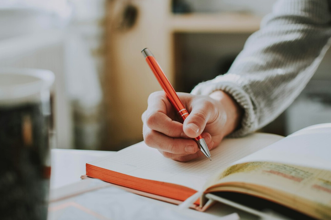 person journaling emotions
