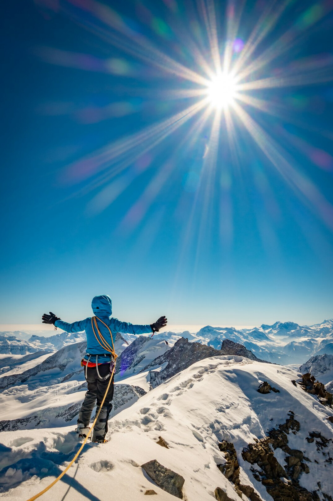 person climbing mountain