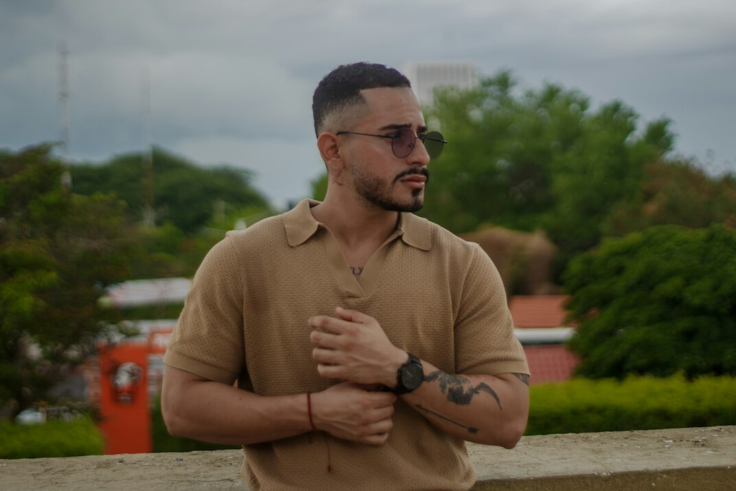 Brazilian man content coordinator with short hair